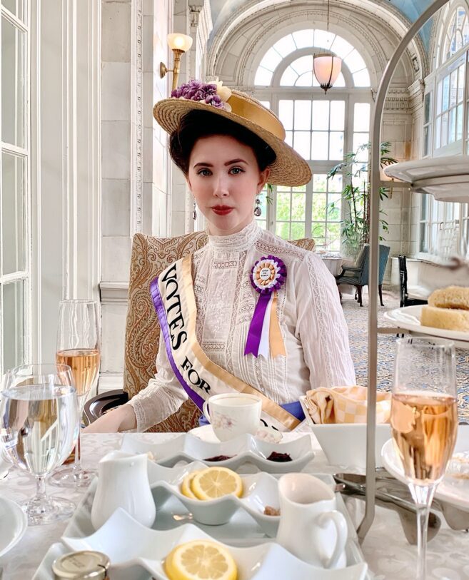 Woman suffragette having tea.